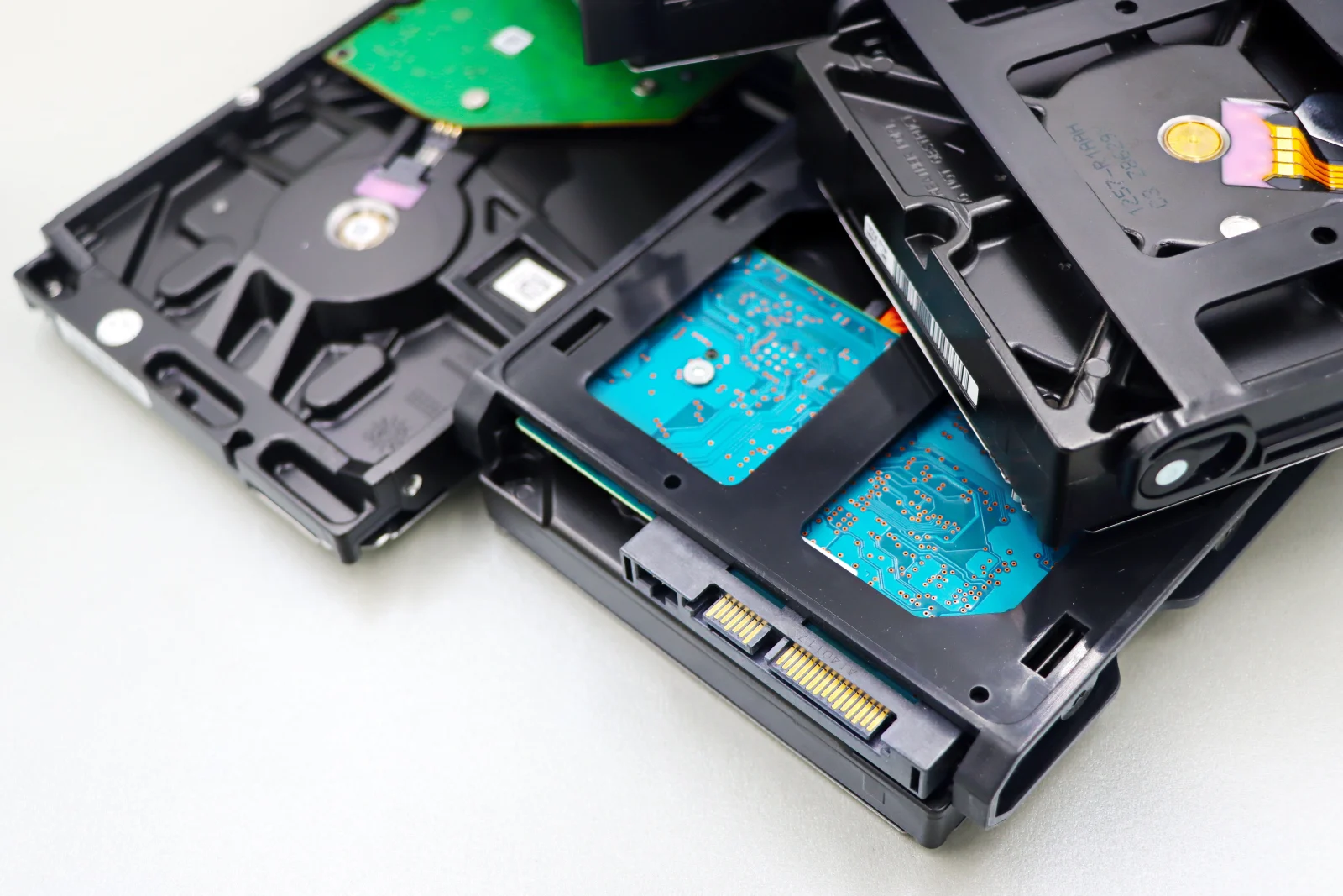Stack of internal hard disk drives for digital storage on white background. Stack of internal hard disk drives for digital storage on white background.