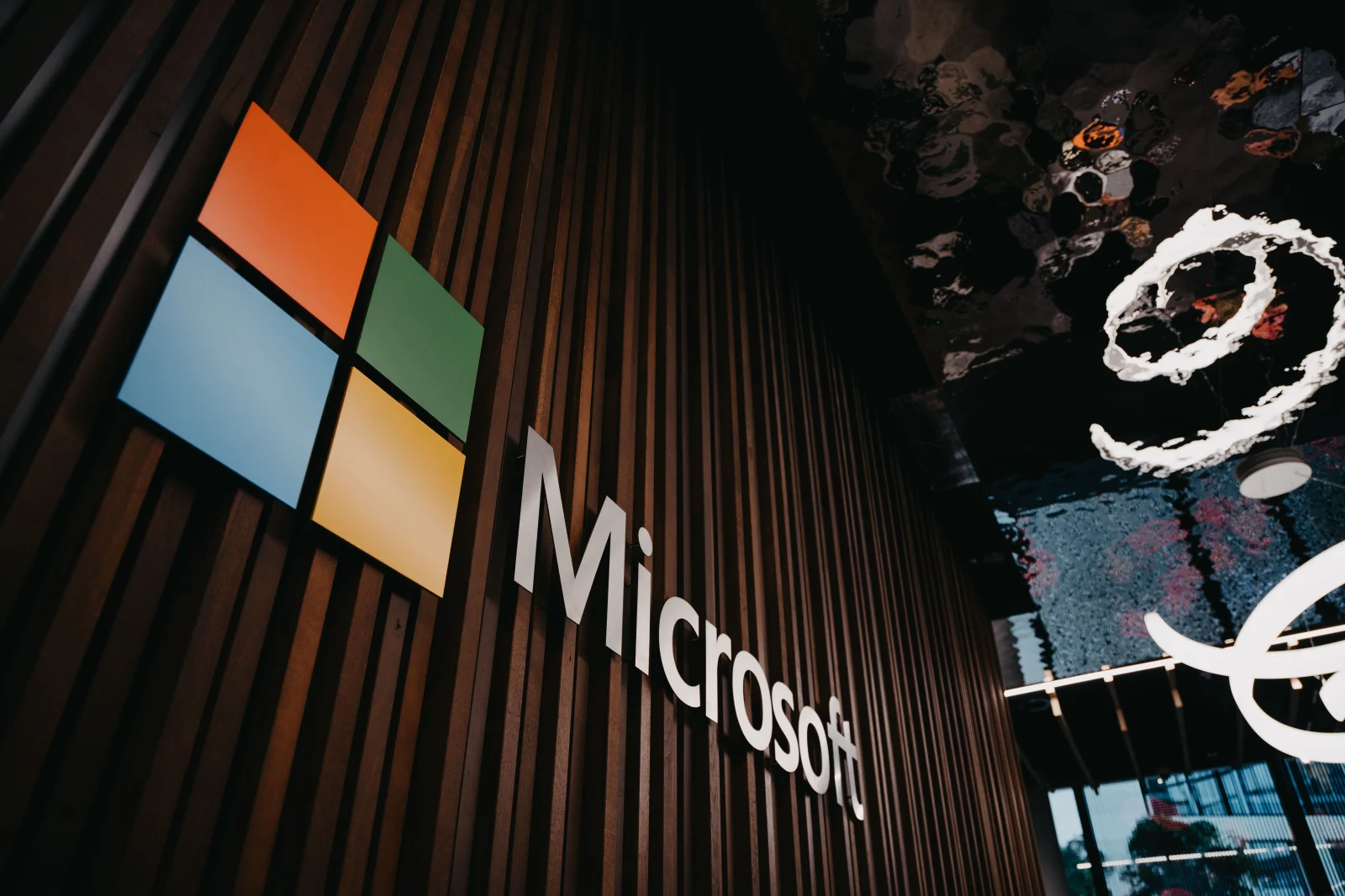 Interior view of Microsoft office with logo on wooden wall in Brussels, Belgium. Interior view of Microsoft office with logo on wooden wall in Brussels, Belgium.