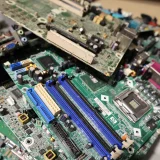 Close-up of stacked circuit boards illustrating e-waste recycling and technology management.